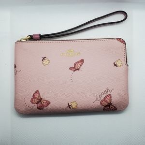 COACH pink butterfly wristlet